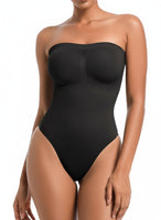 Black strapless bodysuit worn by a model on a white background
