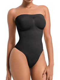 Black strapless bodysuit worn by a model on a white background