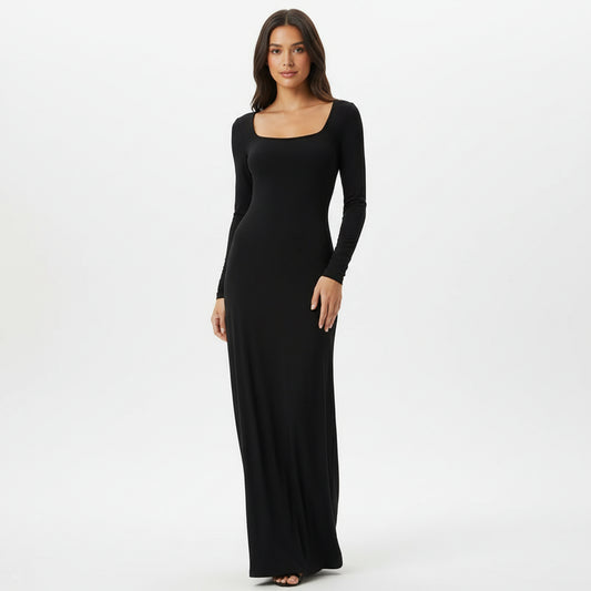 Black evening gown on a mannequin against a white background