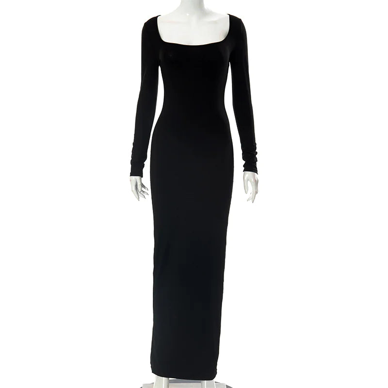 Black evening gown on a mannequin against a white background