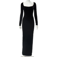 Black evening gown on a mannequin against a white background
