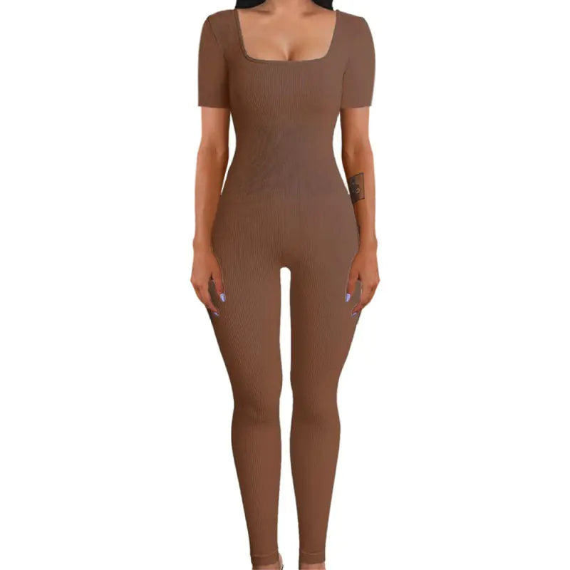 Brown bodysuit worn by a model on a white background